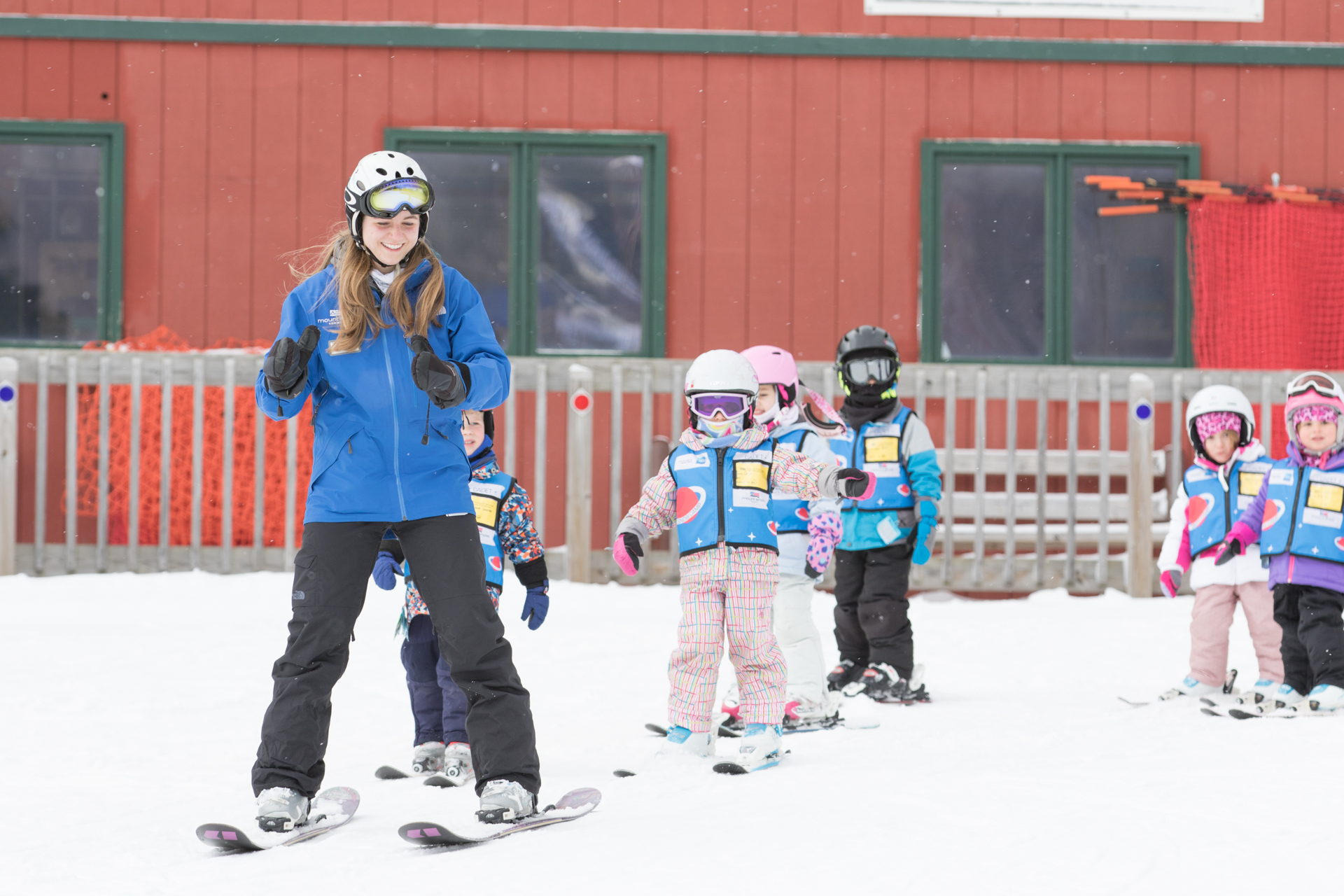 Ski Instructor Guides Kids Ski Lesson at Mount Snow